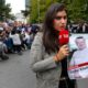 Photo of journalist holding a poster of missing Saudi writer Jamal Khashoggi