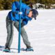 Photo of worker taking snow survey at Phillips Station, California