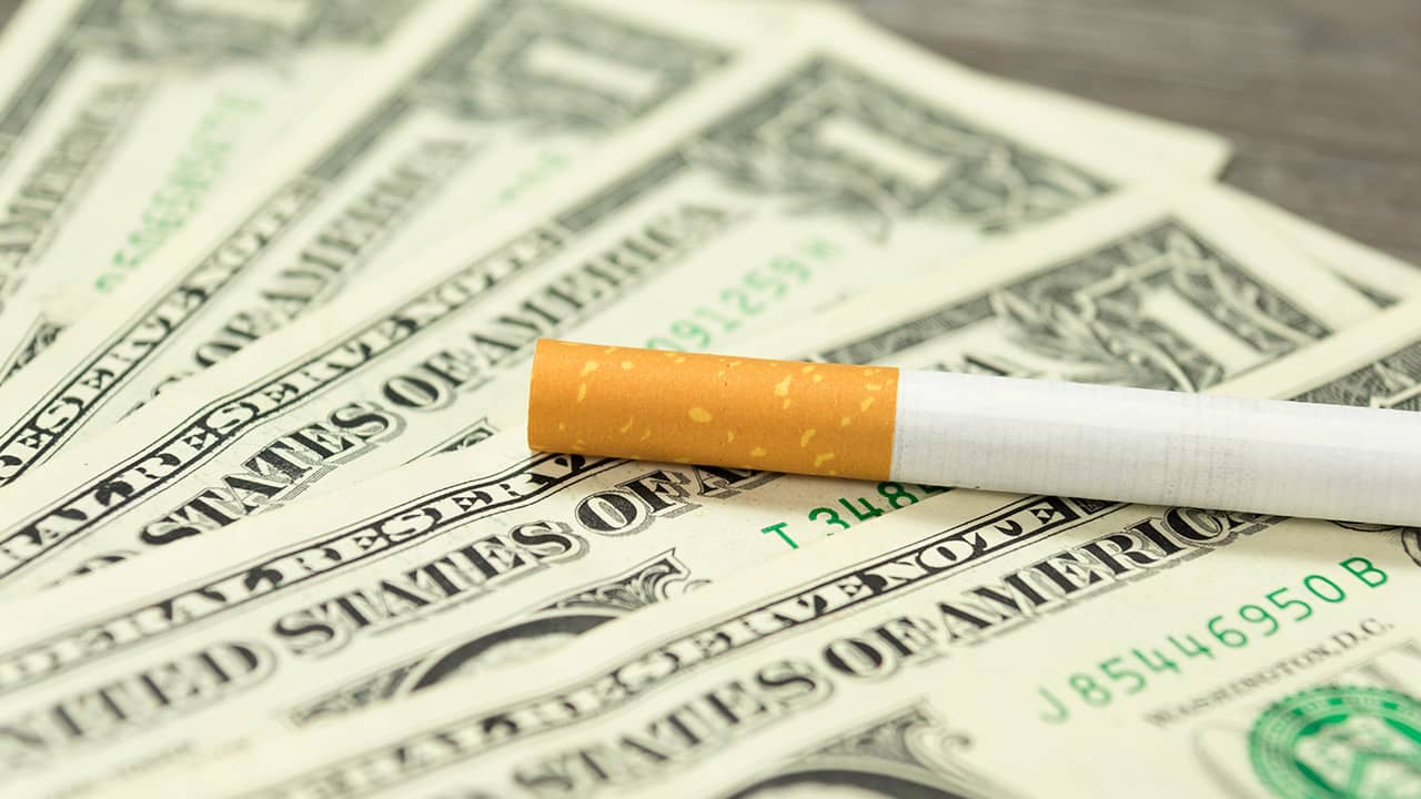 Photo of cigarette and money