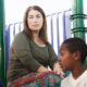 Photo of 2 kids and a mother on a playground