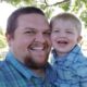 Photo of John Weir holding his son, Steven